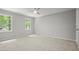 Spacious bedroom with two windows offering lots of natural light and a ceiling fan at 3120 Beechwood Se Dr, Marietta, GA 30067