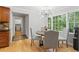 Bright breakfast nook with a modern chandelier and large windows overlooking the backyard garden at 3120 Beechwood Se Dr, Marietta, GA 30067