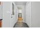 Hallway leading to a laundry room with tiled floors and white walls at 3120 Beechwood Se Dr, Marietta, GA 30067