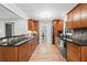 Gourmet kitchen with wood cabinetry, granite countertops, and stainless steel appliances for the discerning chef at 3120 Beechwood Se Dr, Marietta, GA 30067