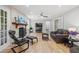 Spacious living room with hardwood floors, fireplace, and comfortable leather seating, perfect for relaxation at 3120 Beechwood Se Dr, Marietta, GA 30067