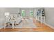 Bright living room featuring hardwood floors and modern white furniture at 3120 Beechwood Se Dr, Marietta, GA 30067