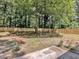 Wide shot of the backyard featuring a new wooden fence and mature trees at 373 Hemlock Dr, Lawrenceville, GA 30046