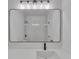Modern bathroom featuring large mirror reflecting the stylish shower with marble-like walls and fixtures at 373 Hemlock Dr, Lawrenceville, GA 30046