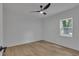 Bright bedroom featuring hardwood floors and a modern ceiling fan at 373 Hemlock Dr, Lawrenceville, GA 30046