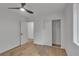 Bedroom featuring a ceiling fan, closet with sliding doors, and doorway to the hall at 373 Hemlock Dr, Lawrenceville, GA 30046