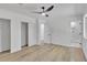 Bedroom featuring hardwood floors, ceiling fan, walk-in closet, and an ensuite bath at 373 Hemlock Dr, Lawrenceville, GA 30046