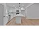 Modern kitchen with white cabinets, stainless steel appliances, and an island perfect for food preparation and casual dining at 373 Hemlock Dr, Lawrenceville, GA 30046