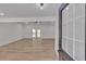 Spacious living room featuring hardwood floors and French doors leading to the outdoors, offering ample natural light at 373 Hemlock Dr, Lawrenceville, GA 30046