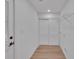 Practical mudroom with closet and door, providing convenient storage and easy access to the outdoors at 373 Hemlock Dr, Lawrenceville, GA 30046