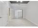 This bedroom features a large mirrored closet, all white walls, and tile flooring at 855 Peachtree Ne St # 2812, Atlanta, GA 30308