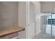Hallway with custom bench, storage closet and view of the city skyline at 855 Peachtree Ne St # 2812, Atlanta, GA 30308