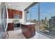 Modern kitchen with stainless steel appliances, granite countertops and stunning cityscape views at 855 Peachtree Ne St # 2812, Atlanta, GA 30308