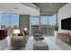 Bright living room featuring modern furniture, floor to ceiling windows and city views at 855 Peachtree Ne St # 2812, Atlanta, GA 30308