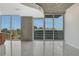 Open living space with tile flooring and wall to wall windows showcasing city views in Atlanta at 855 Peachtree Ne St # 2912, Atlanta, GA 30308