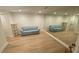 Finished basement with mirrored wall, neutral paint and flooring at 1813 Baldwin Farms Dr, Marietta, GA 30068