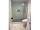 Modern bathroom shower with glass enclosure, built-in niche, and rainfall shower head at 1813 Baldwin Farms Dr, Marietta, GA 30068