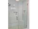Modern bathroom shower featuring white subway tile, glass enclosure, and built-in niche at 1813 Baldwin Farms Dr, Marietta, GA 30068