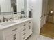 Bright bathroom features a double vanity with marble floors, silver fixtures, and great lighting at 1813 Baldwin Farms Dr, Marietta, GA 30068