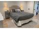 Bedroom featuring a tufted headboard, neutral decor, and matching nightstands at 1813 Baldwin Farms Dr, Marietta, GA 30068