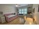Charming bedroom featuring a plush daybed, built-in shelves, and a whimsical hanging chair at 1813 Baldwin Farms Dr, Marietta, GA 30068