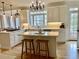 Gourmet kitchen with white cabinetry, a large island, stainless steel appliances, and pendant lighting at 1813 Baldwin Farms Dr, Marietta, GA 30068