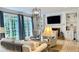 Bright living room features large windows, a fireplace, built-in shelving, and comfortable seating at 1813 Baldwin Farms Dr, Marietta, GA 30068