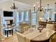 Open-concept living space that features a fireplace, dining table, and access to the kitchen at 1813 Baldwin Farms Dr, Marietta, GA 30068