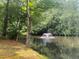 Picturesque pond surrounded by lush greenery with a fountain adding a touch of serenity at 1813 Baldwin Farms Dr, Marietta, GA 30068