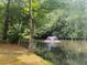 Scenic pond view featuring a fountain and lush greenery, offering a tranquil and picturesque setting at 1813 Baldwin Farms Dr, Marietta, GA 30068