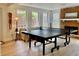Recreation room featuring a fireplace, ping pong table, and a seating area at 1813 Baldwin Farms Dr, Marietta, GA 30068