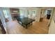 Spacious recreation room featuring a fireplace, ping pong table, and access to an outdoor patio at 1813 Baldwin Farms Dr, Marietta, GA 30068
