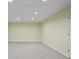 Spacious basement area with carpet flooring and recessed lighting, ready for finishing and customization at 2316 Fripp Overlook Nw, Acworth, GA 30101