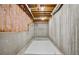 Unfinished basement with exposed beams and insulation, offering a blank canvas for future development at 2316 Fripp Overlook Nw, Acworth, GA 30101