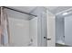 Bathroom shower with white tiling and patterned shower curtain at 2316 Fripp Overlook Nw, Acworth, GA 30101