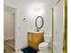 Bathroom featuring wooden vanity, toilet, mirror, and shower stall with patterned glass and brass trim at 2316 Fripp Overlook Nw, Acworth, GA 30101