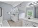 Bathroom featuring sinks and a towel rack, with shower visible through doorway at 2316 Fripp Overlook Nw, Acworth, GA 30101