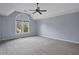 Spacious bedroom with vaulted ceilings, a ceiling fan, and a large window offering ample natural light at 2316 Fripp Overlook Nw, Acworth, GA 30101
