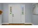 Interior front door with sidelights and fresh neutral paint and wood flooring at 2316 Fripp Overlook Nw, Acworth, GA 30101