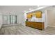 Basement living room area featuring wood floors, small cabinets, and a sink at 2316 Fripp Overlook Nw, Acworth, GA 30101