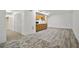 Basement living room area with wood floors and a small kitchen at 2316 Fripp Overlook Nw, Acworth, GA 30101