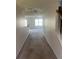 Hallway view leading to the living area, showcasing the staircase and overall layout of the home at 730 Georgetown Ln, Jonesboro, GA 30236