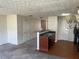 Open-concept living space with bar seating and access to the second floor at 730 Georgetown Ln, Jonesboro, GA 30236