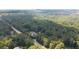 Breathtaking aerial view of the property nestled among mature trees, offering both privacy and natural beauty at 2179 Mountclaire Ct, Stone Mountain, GA 30087
