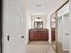 Bathroom with dark wood cabinets and decorative lighting at 2179 Mountclaire Ct, Stone Mountain, GA 30087