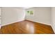 Bedroom with hardwood flooring and natural light from the window at 2179 Mountclaire Ct, Stone Mountain, GA 30087