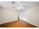 Bedroom featuring hardwood floors, ample natural light, and a large closet at 2179 Mountclaire Ct, Stone Mountain, GA 30087