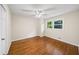 Bedroom featuring hardwood floors, ample natural light, and a ceiling fan at 2179 Mountclaire Ct, Stone Mountain, GA 30087