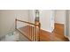 Light-filled entryway features hardwood floors and a classic staircase with white spindles at 2179 Mountclaire Ct, Stone Mountain, GA 30087