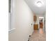 Neutral hallway featuring tile flooring and a sink and cabinet area at 2179 Mountclaire Ct, Stone Mountain, GA 30087